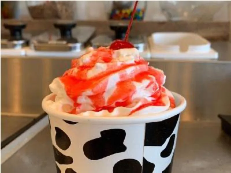 Ice cream sundae with cherry and whipped cream at Brant Rock HOP